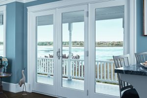 White patio doors with a view.